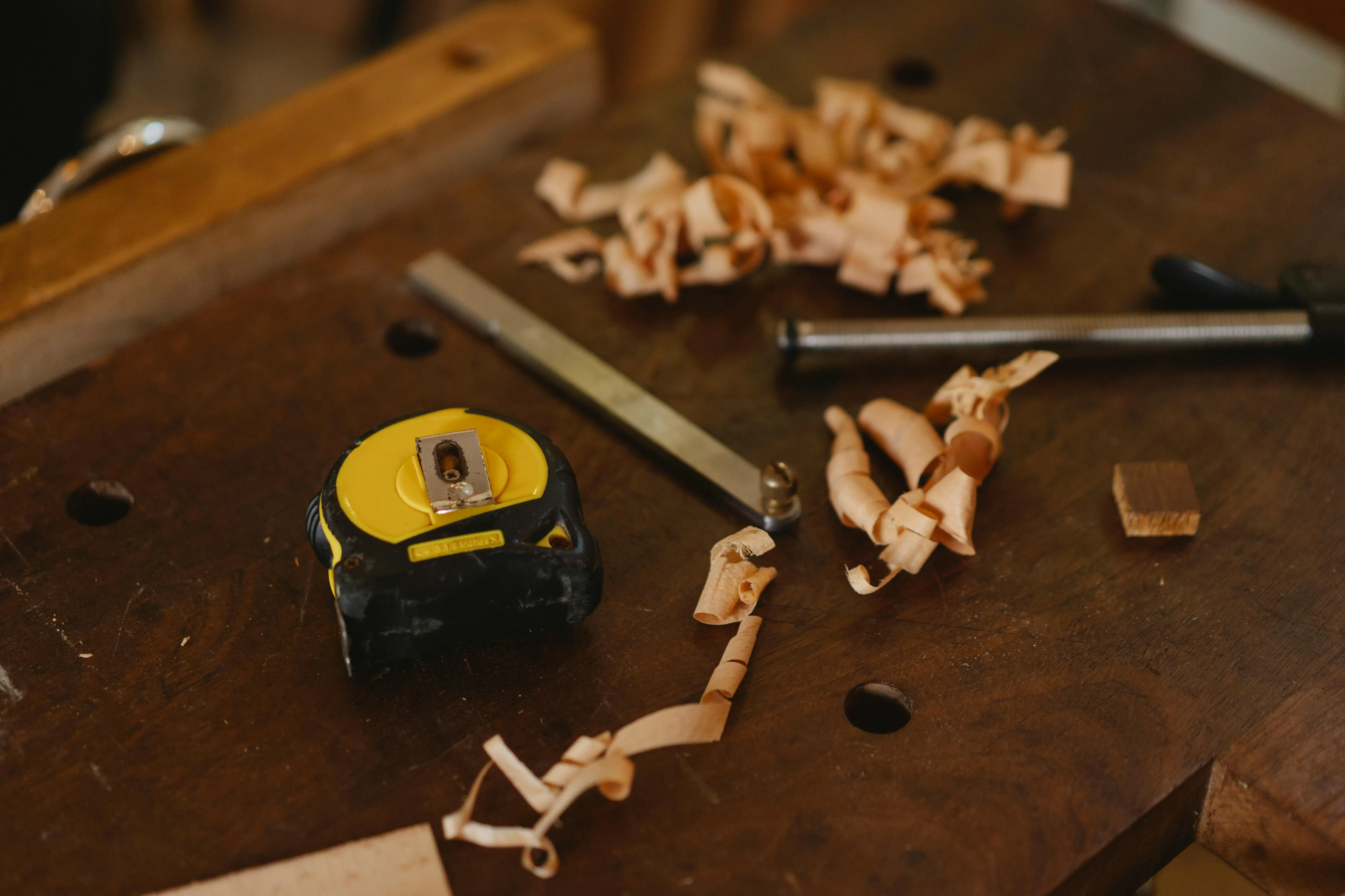 Wood with tools and shavings on